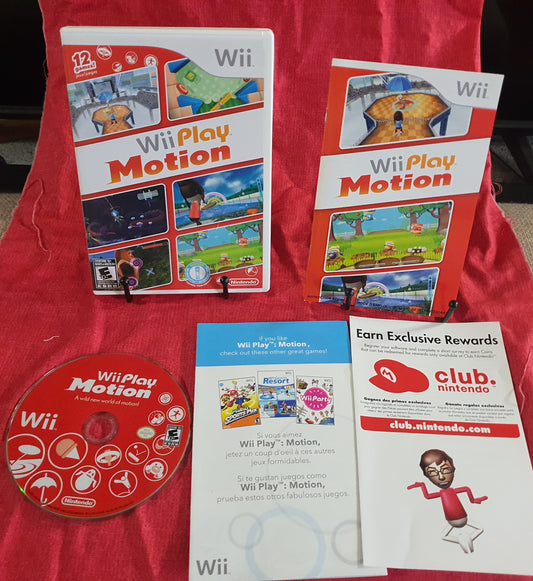 Wii Play Motion game packaging with a disc and promotional leaflet on a red surface.