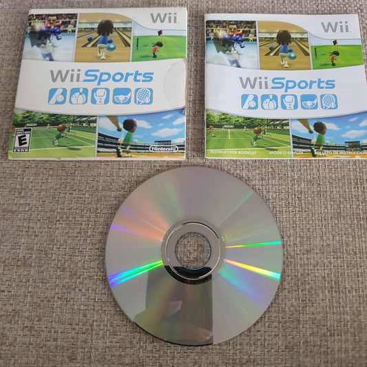 Wii Sports game case and disc on a textured surface