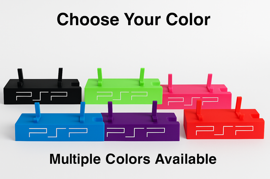 Five PSP gaming console stands in black, green, red, blue, and purple on a white background.