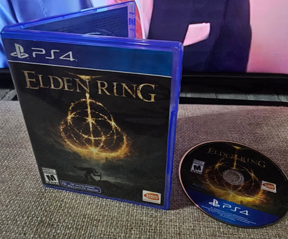 PlayStation 4 game disc and cover titled 'Elven Ring' on a textured surface.