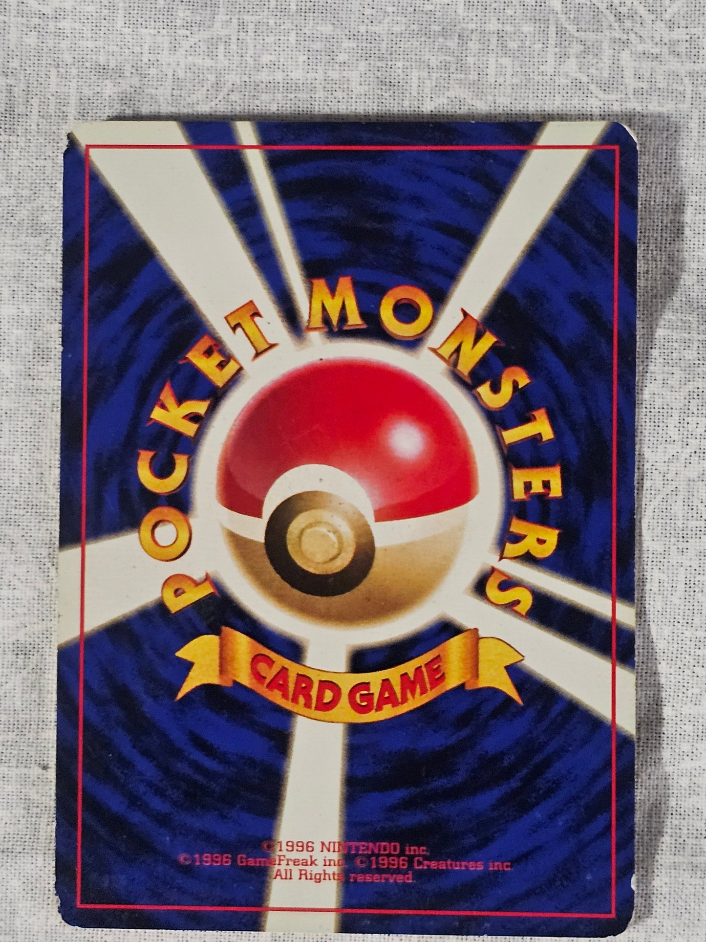 Pokémon card with 'Monsters' and 'Rocké' text on a blue and red background