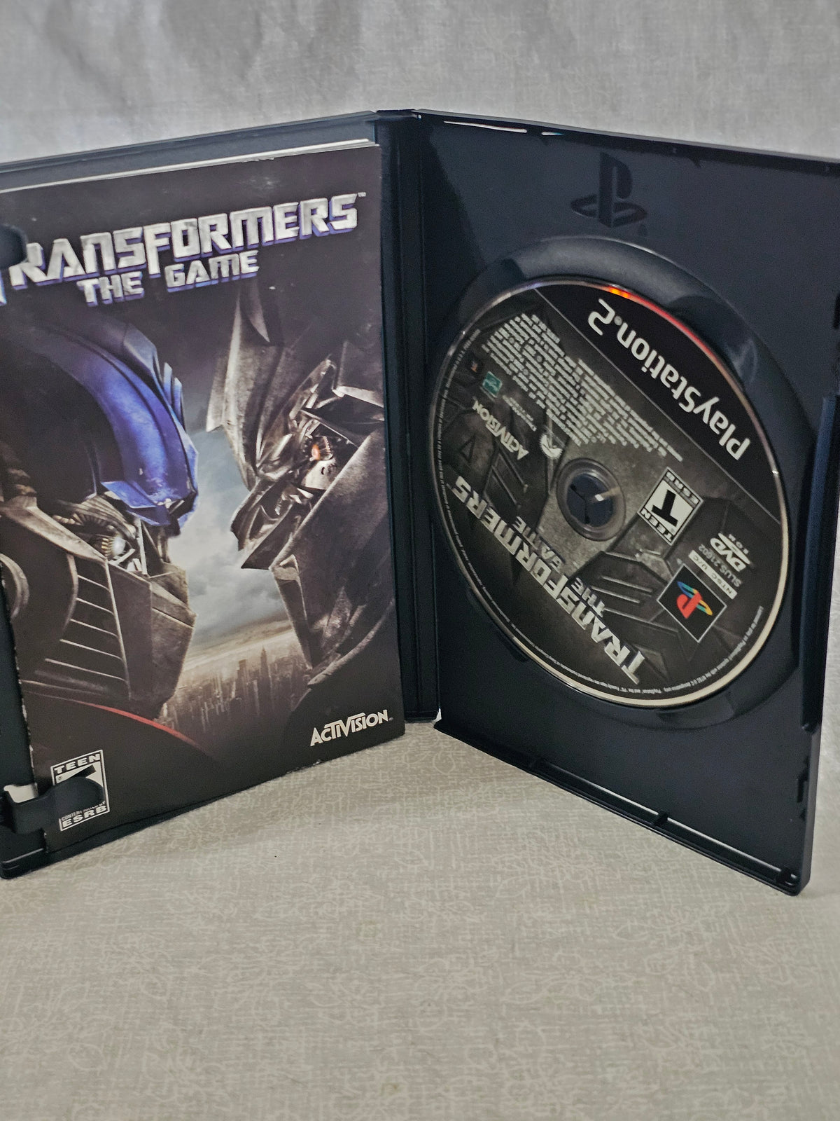 Transformers The Game PS2 PlayStation 2 2007 Activision Disc Complete Tested Movie Tie Autobots Decepticons Collector Edition Action Adventure