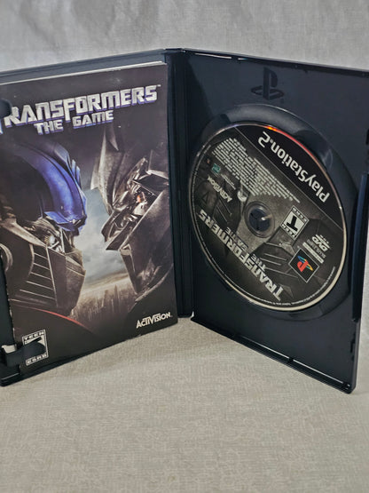 Transformers The Game PS2 PlayStation 2 2007 Activision Disc Complete Tested Movie Tie Autobots Decepticons Collector Edition Action Adventure