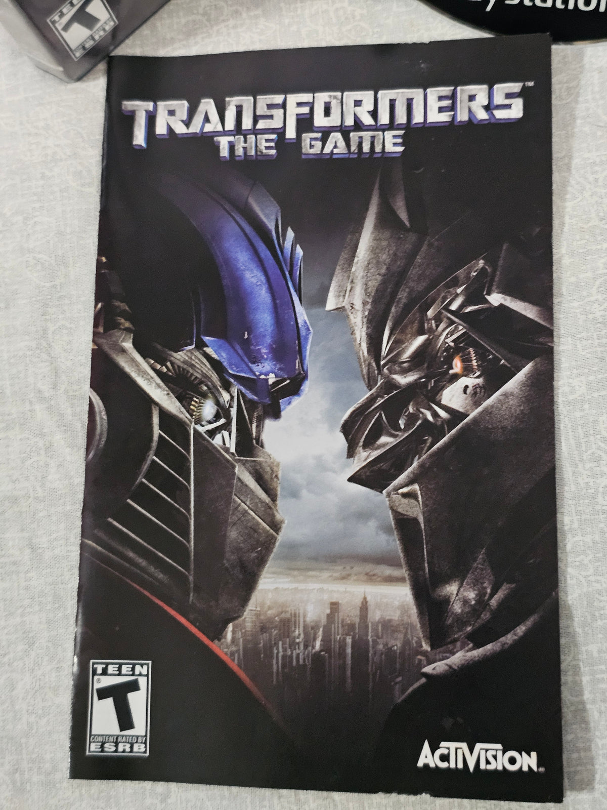 Transformers The Game PS2 PlayStation 2 2007 Activision Disc Complete Tested Movie Tie Autobots Decepticons Collector Edition Action Adventure
