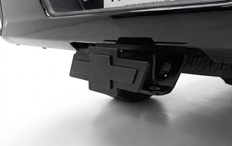 Bumper with hitch receiver and 'TX Hitch' license plate on a white background
