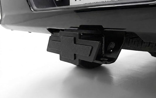 Bumper with hitch receiver and 'TX Hitch' license plate on a white background