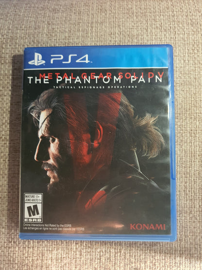 Game case for 'The Phantom Pain' on a PS4 console with Konami branding.
