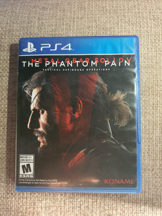 Game case for 'The Phantom Pain' on a PS4 console with Konami branding.