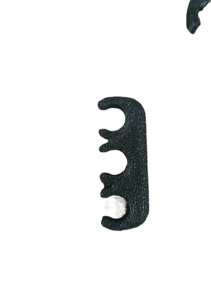 Black archery bow nocking block on a white background