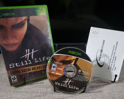 Xbox game disc and case on a textured surface