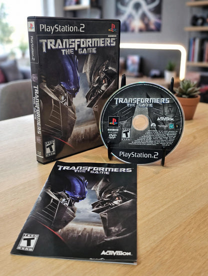 Transformers The Game PS2 PlayStation 2 2007 Activision Disc Complete Tested Movie Tie Autobots Decepticons Collector Edition Action Adventure