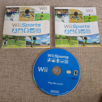 Wii Sports game case and disc on a textured surface